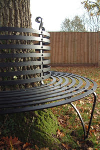 riveted ironwork tree seat