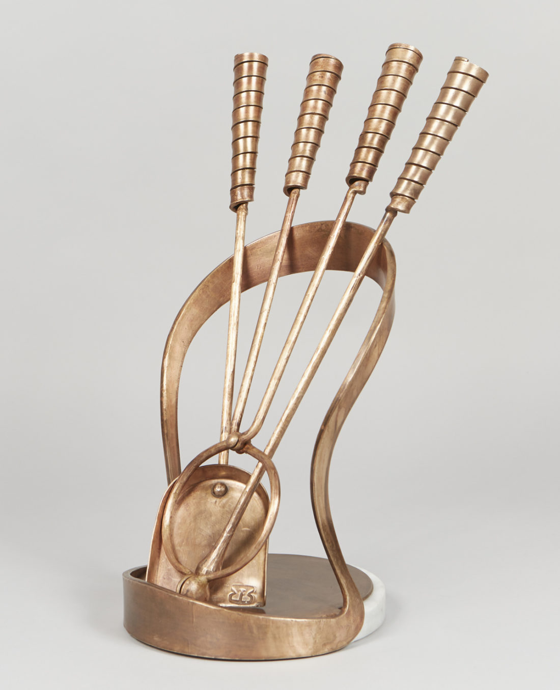Omega contemporary bronze fire tools. A combination of exquisite forged bronze and carrera marble make this companion set of contemporary bronze fire tools a timeless addition to any fire place.