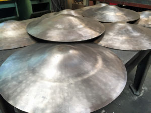 bronze lids formed on hydraulic press