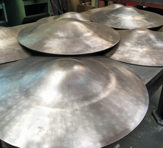bronze lids formed on hydraulic press