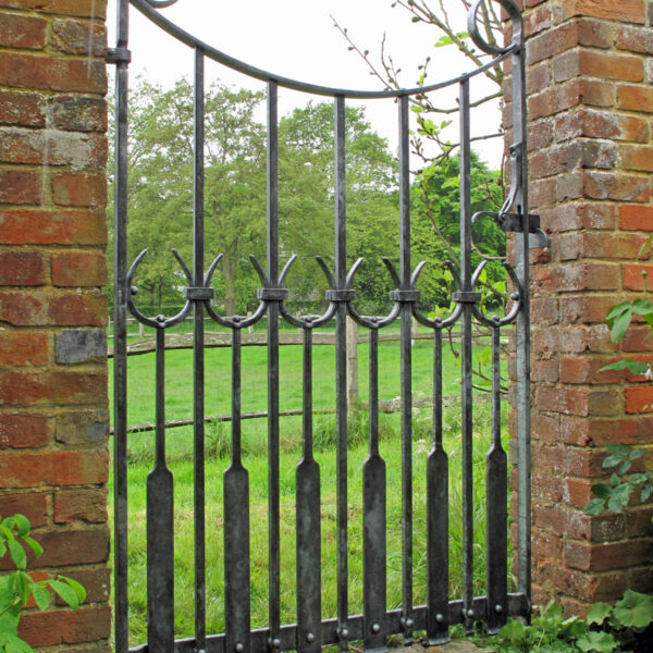 Forged iron gate with a design based on tulips for an east sussex house
