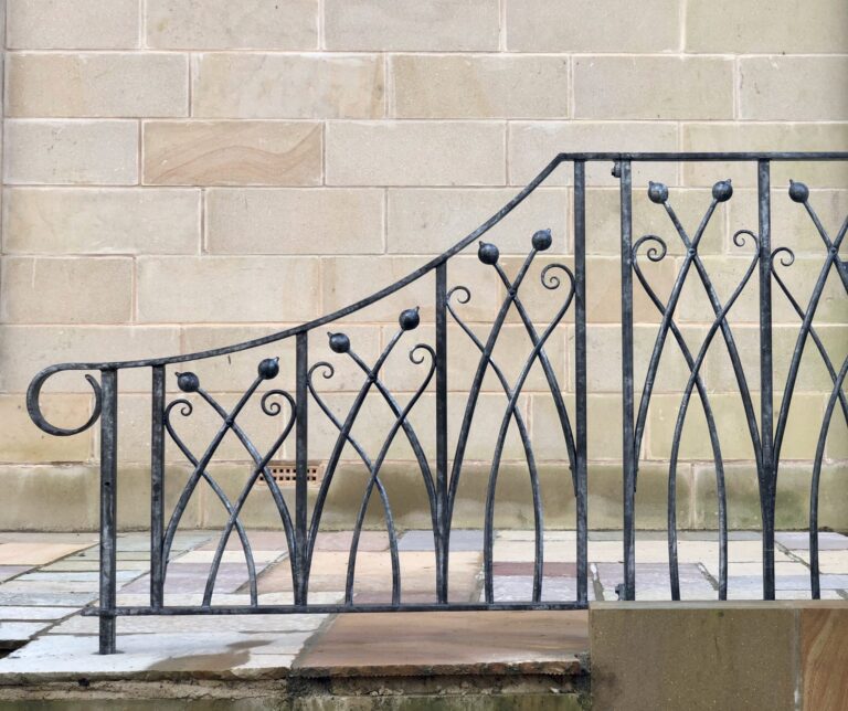 Hand forged bespoke iron railing in a design inspired by nature and plants