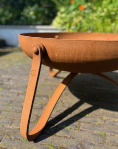 Corten style steel fire bowl for contemporary garden design by James Price