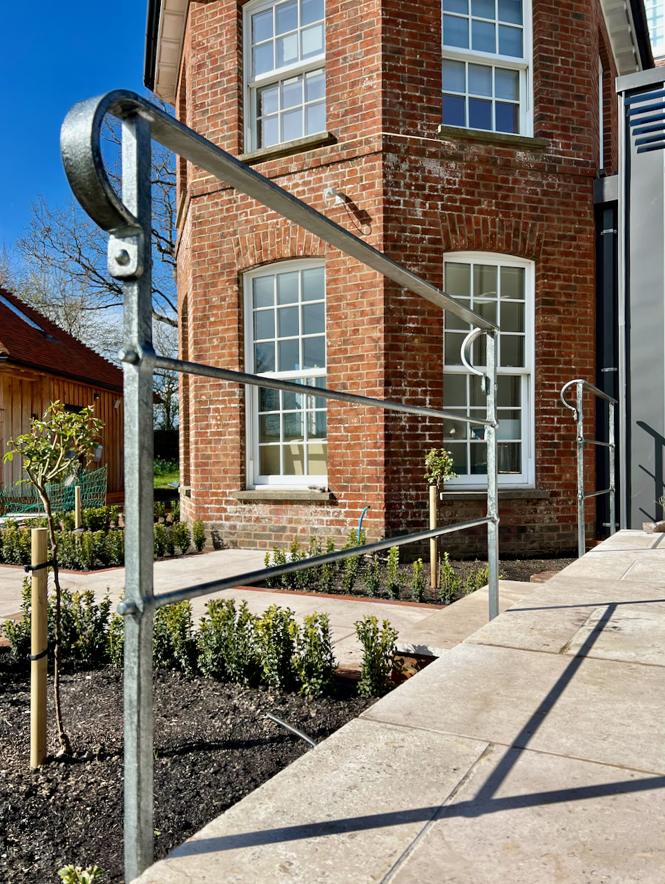 Contemporary forged iron patio railing