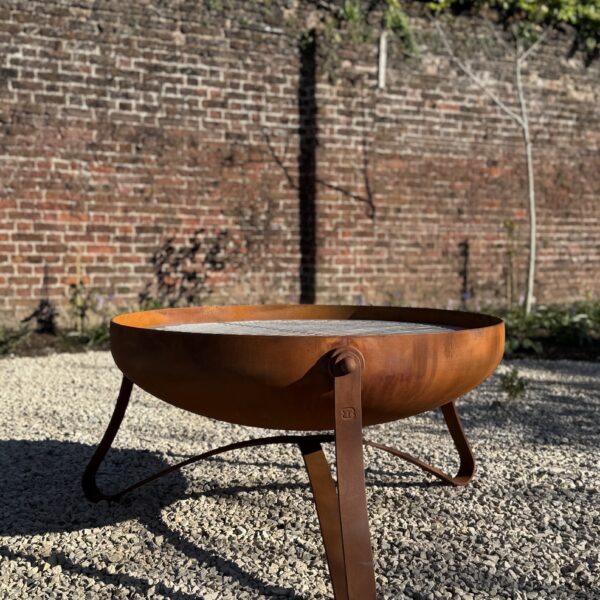 Bespoke fire bowl in a contemporary design with a rusted oxide finish
