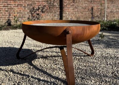 Bespoke fire bowl in a contemporary design with a rusted oxide finish