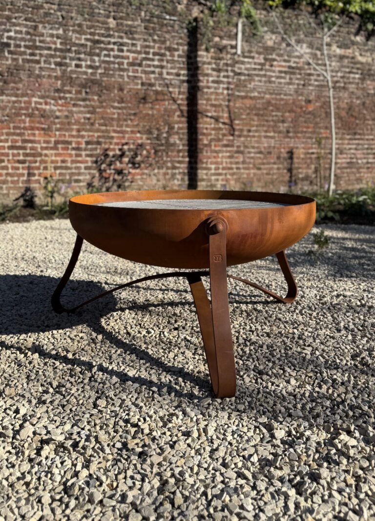 Bespoke fire bowl in a contemporary design with a rusted oxide finish