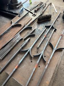 Fire welded forgings for a pair of bespoke gates for a swimming pool