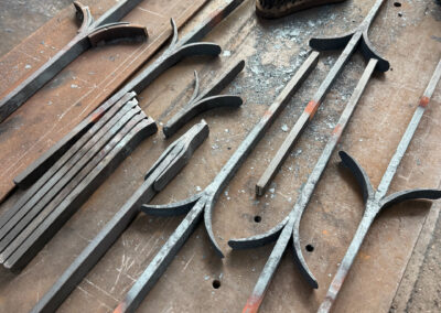 Fire welded forgings for a pair of bespoke gates for a swimming pool