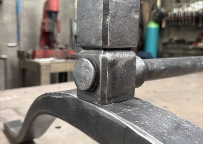 Joinery details on a bespoke forged wishbone table base