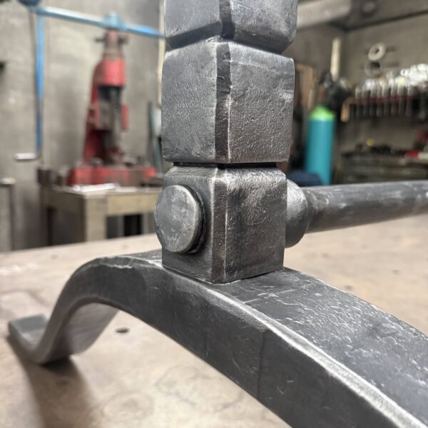 Joinery details on a bespoke forged wishbone table base