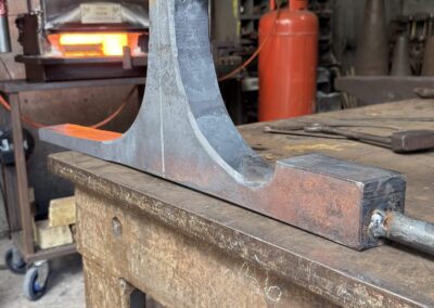 the forging process for making a custom wishbone table