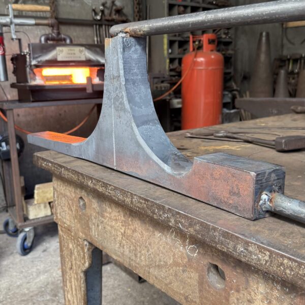 the forging process for making a custom wishbone table