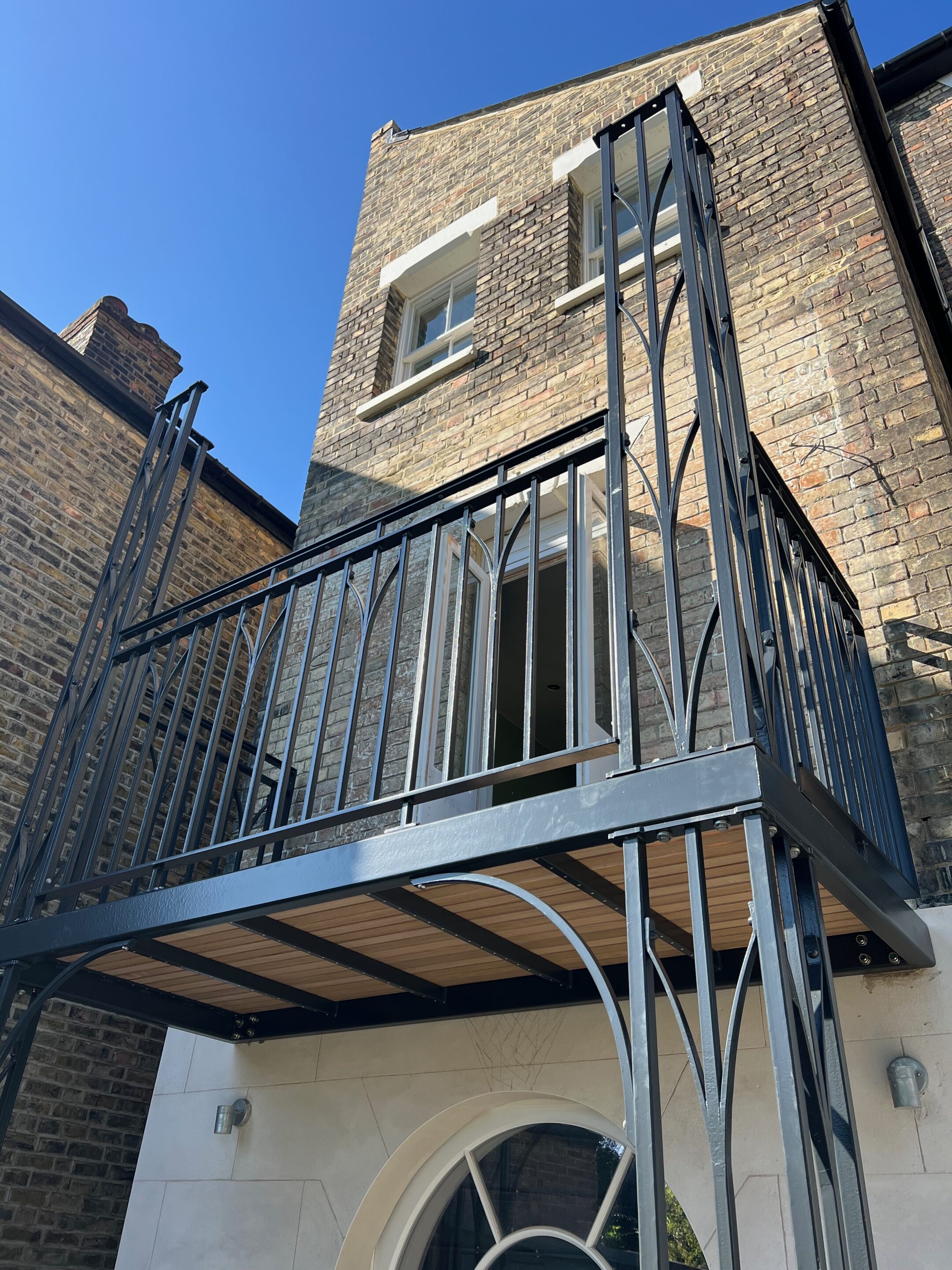 wrought iron balcony with columns on a victorian period property