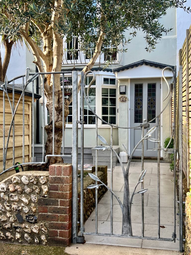 Olive tree wrought iron garden gate for a house in Brighton