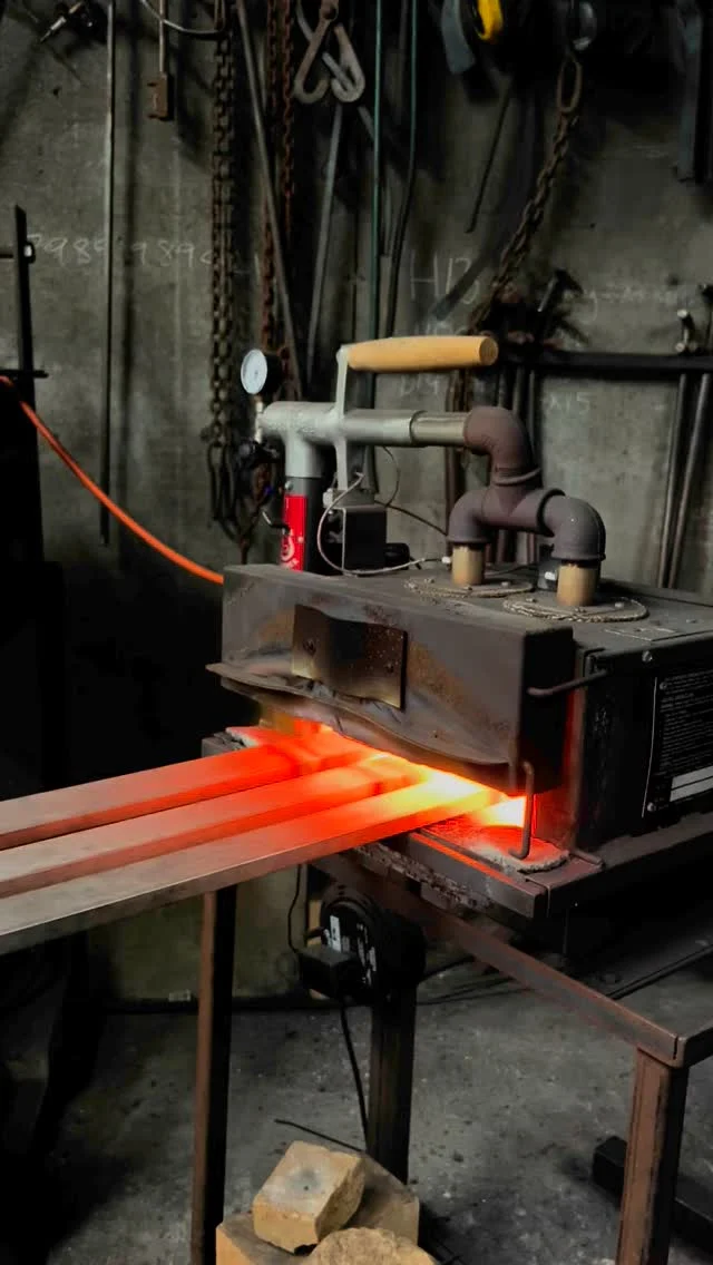 Chomping our way through over 40 linear metres of forged 316 stainless top rail for our current balustrade and railing project. Patrick showing us how it’s done 2m at a time. Forge, flatten, cool, straighten then repeat …..👌🏼. #massey #forged #powerhammer #metaldesign #balustrade #architecturalmetal #bespoke #blacksmithdesigner